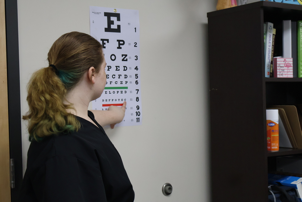 Student conducting a vision screening