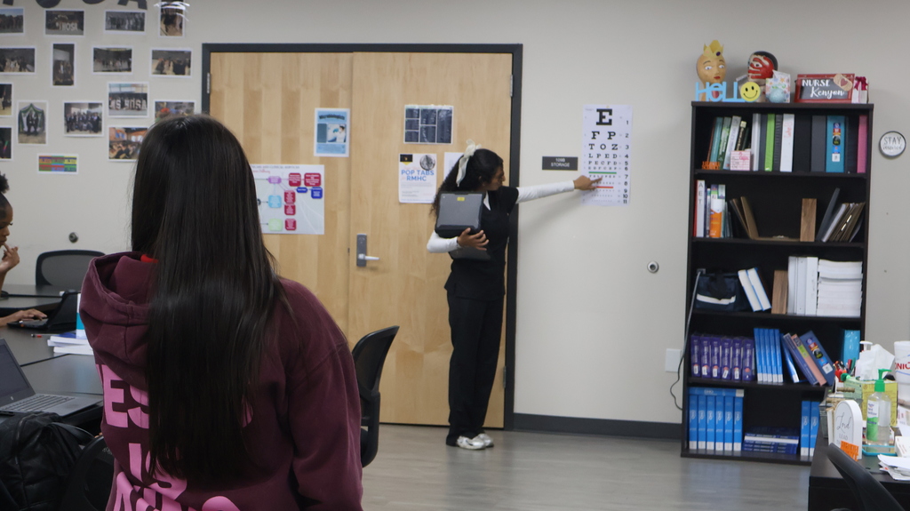 Student conducting a vision screening