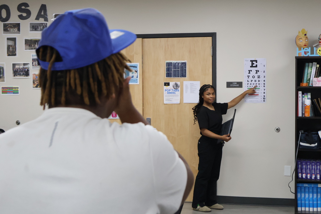 Student conducting a vision screening