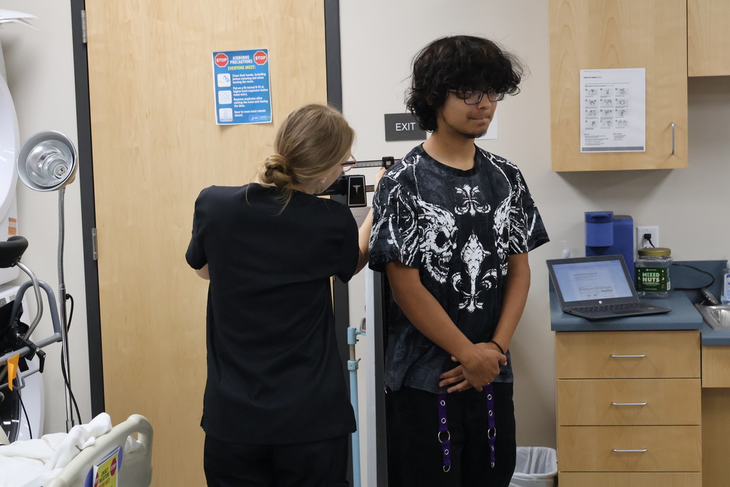 Student conducting a weight screener
