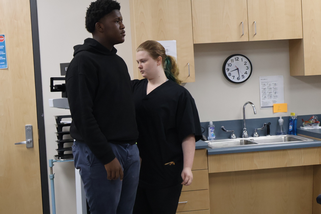 Student conducting a weight screener