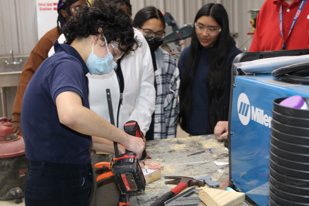 Students making peg game