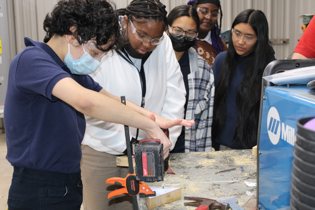 Students making peg game