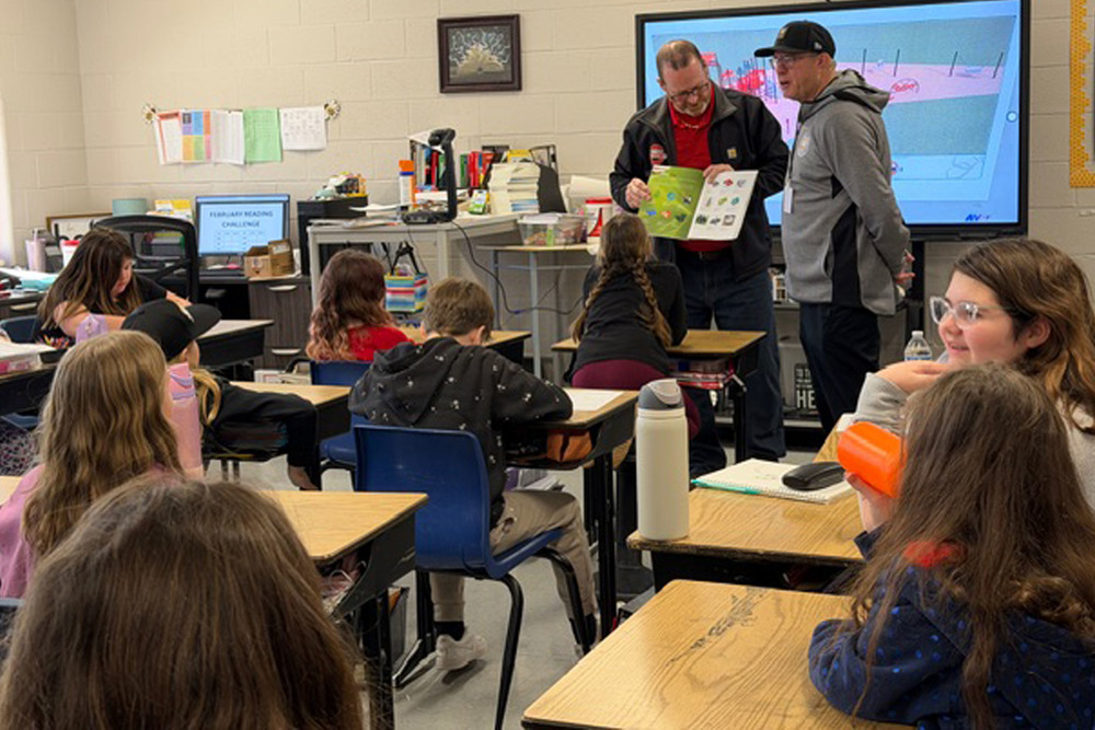 Students look at different design and equipment options for the school’s new playground project.