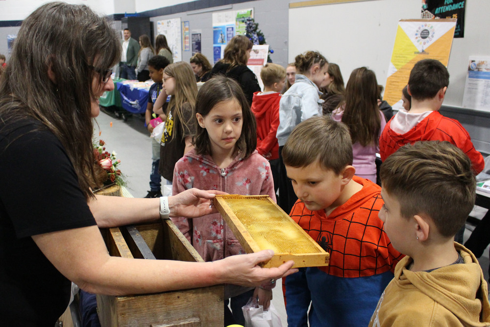 Students talk to professionals at the career fair.