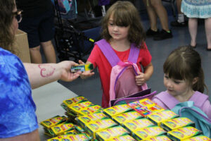 Students receiving supplies from the fair