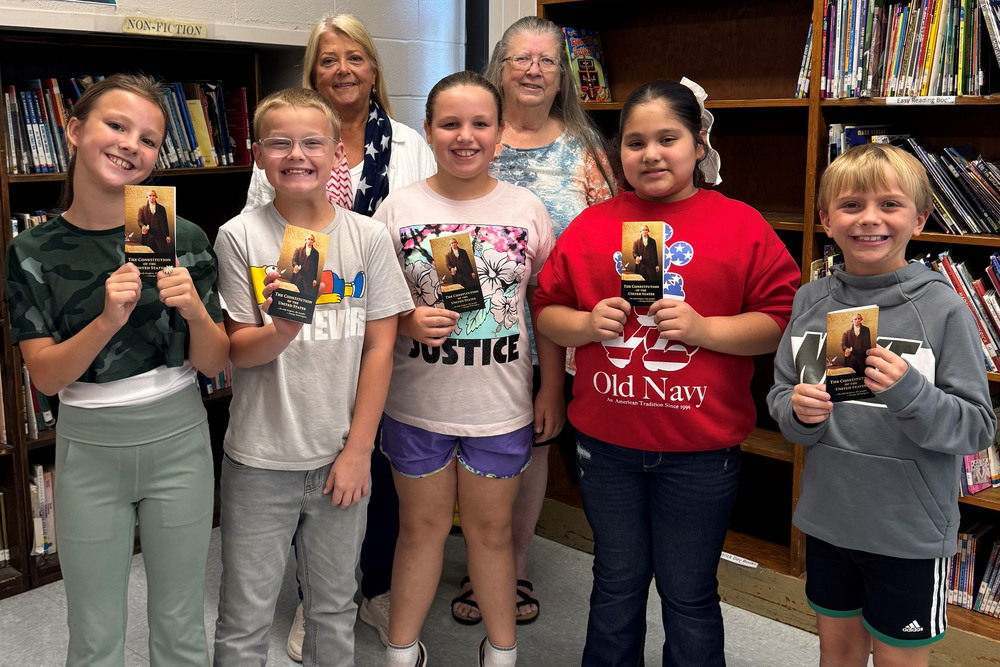 Pictured in the back row, from left, are Linda Criswell and Patricia Weinschenker, members of the Marshall County Chapter of DAR. They are with Central Elementary students, front row from left, Elonna Hartley, Braiden Cunningham, Brylee Owens, Alma Castro-Gamez, and Jaxon Arno who are holding a pocket version of the United States Constitution. 