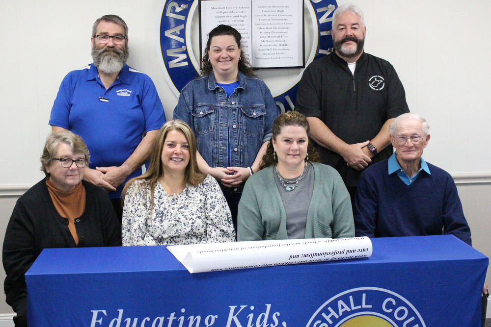 Pictured from left front row: MCS BOE Vice-President Christie Robison, MCS Assistant Superintendent Karen Klamut, MCS Superintendent Dr. Shelby Haines and MCS BOE President John Miller. Back row from left: WVSSPA Marshall County President Wilson Barnes, Education WV Marshall County representative Jessica Romick and MC Chamber Executive Director Scott Reager.