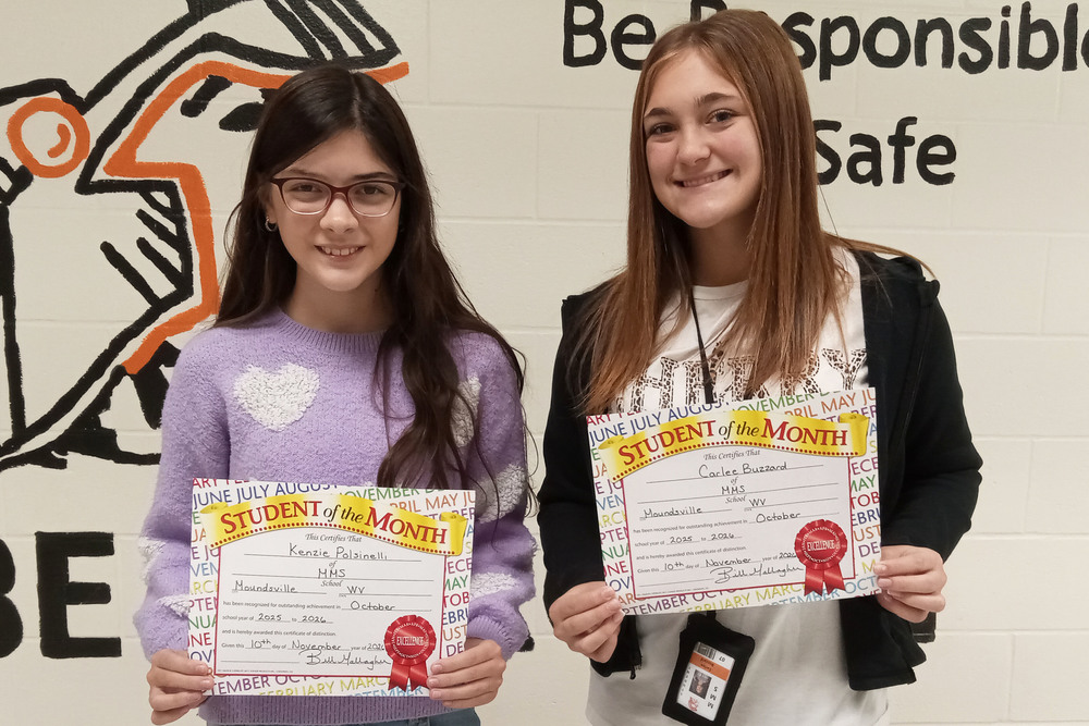 Pictured from left: Kenzie Polsinelli and Carlee Buzzard. Levi Johnson was participating in a school activity the day of the certificate presentation.