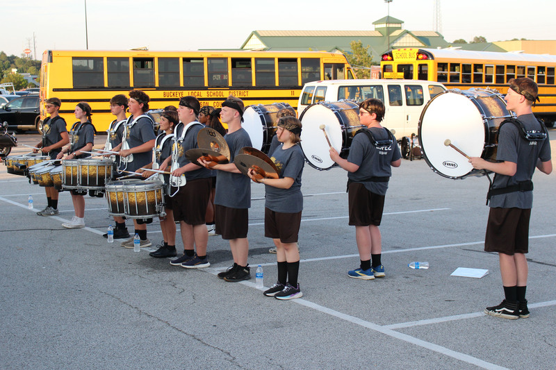 Drumline members from the Marching Monarchs play on TV to kick off to the 2025 football season.