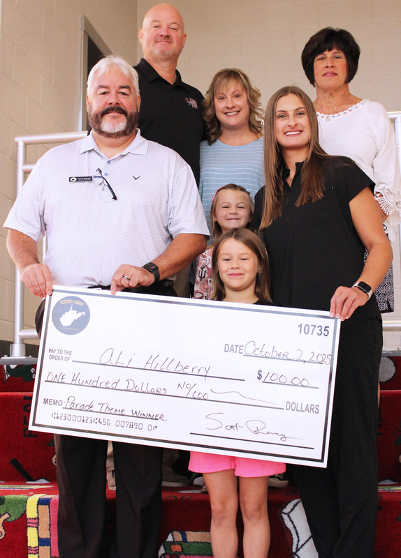 Ali with the Chamber director and her family.