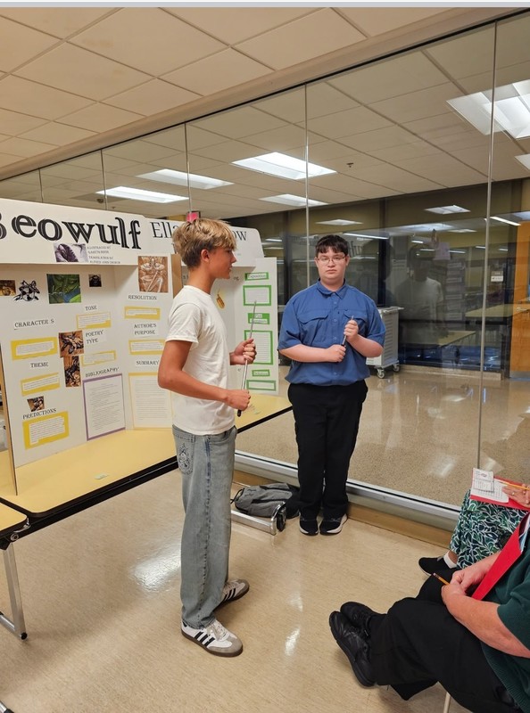 students presenting their project at the fair