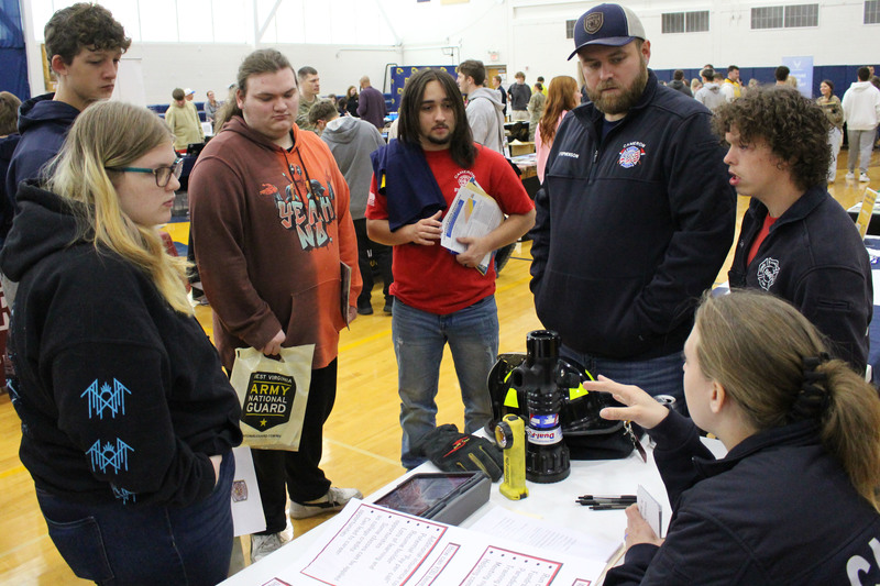 Members of the Cameron Volunteer Fire Department explain how the organization serves the community and benefits the students could earn by becoming a first responder.