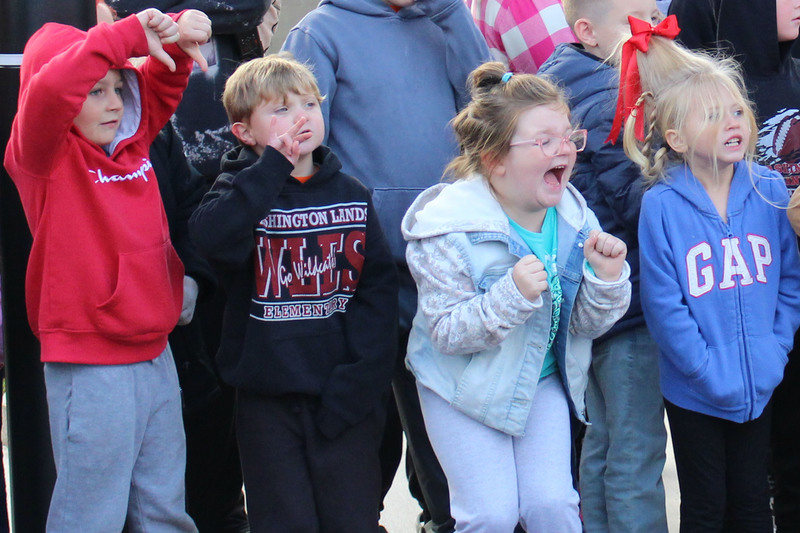 Students count down for the next pumpkin to be dropped.