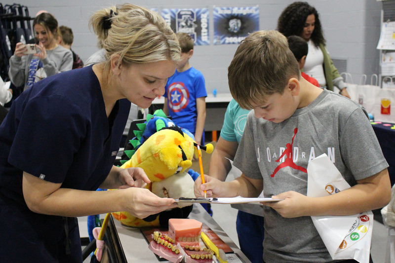 Students talk to professionals at the career fair.