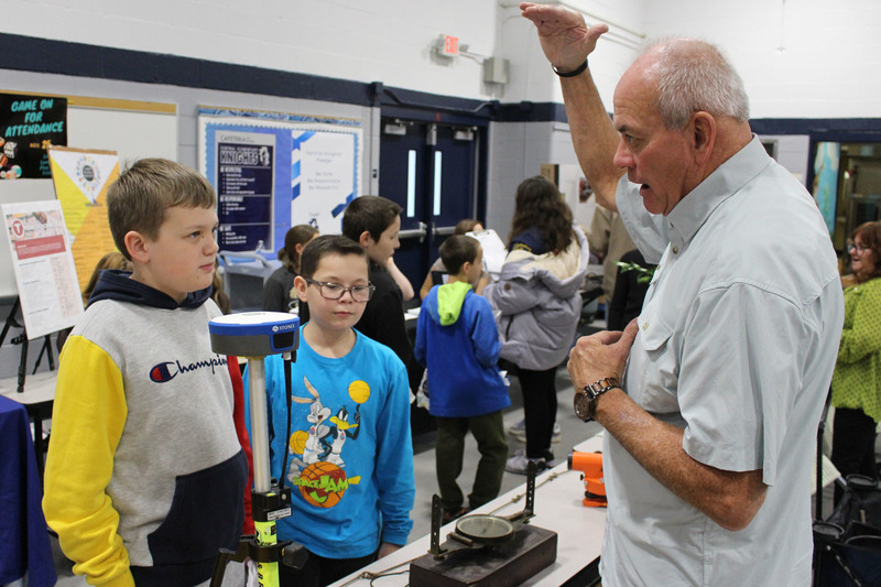 Students talk to professionals at the career fair.