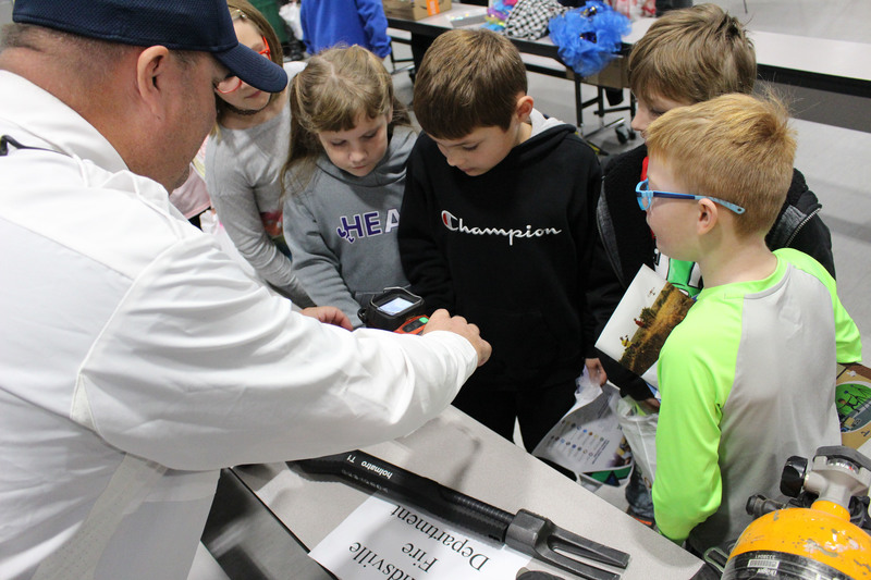 Students talk to professionals at the career fair.