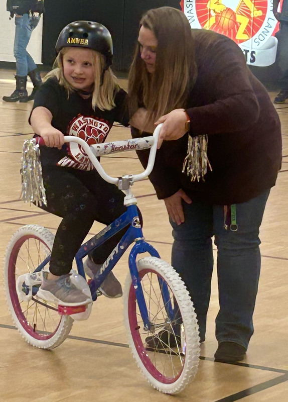 Kids and Warlords Motorcycle Club members with the new bikes.