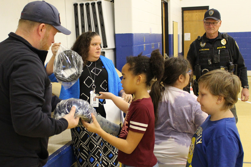 Cameron Elementary students get their new bike helmets.