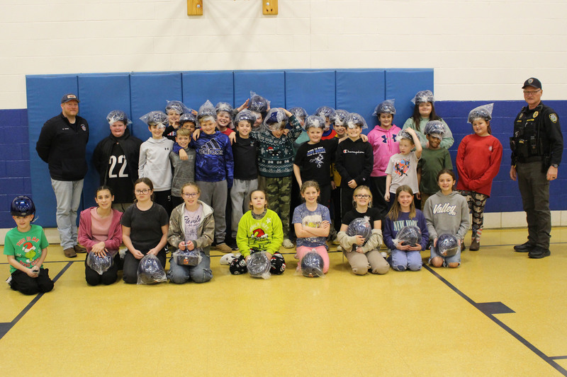 Cameron Elementary students get their new bike helmets.