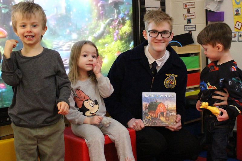 JMHS FFA members reading to McNinch Primary students.