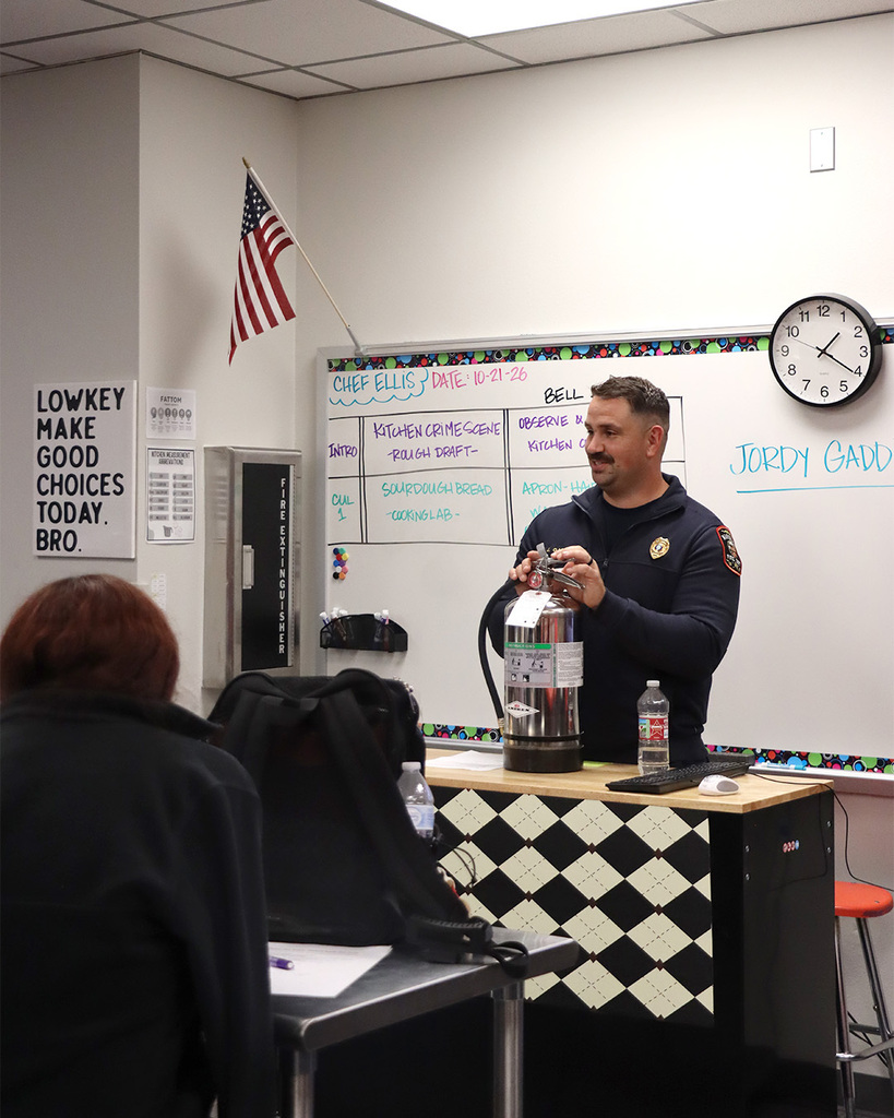 Captain Gaddis, with the Marshall Fire Department teaching our Culinary Arts students about fire safety in the kitchen.