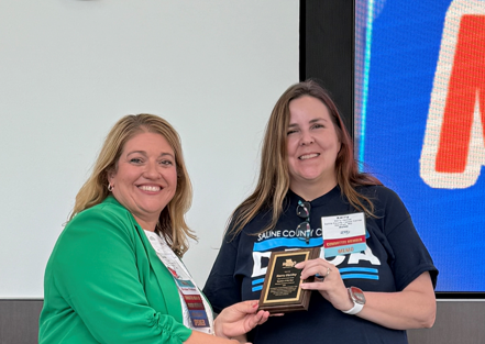 woman receiving plaque