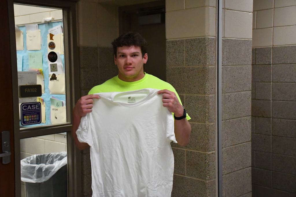 one kid holding white shirt