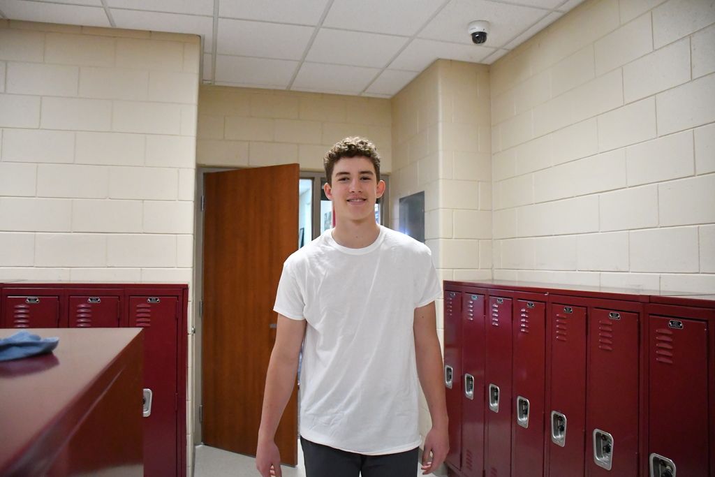 one kid standing with white shirt