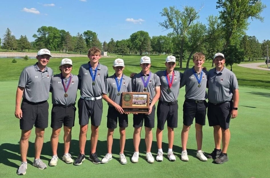 Group of boys holding a plaque