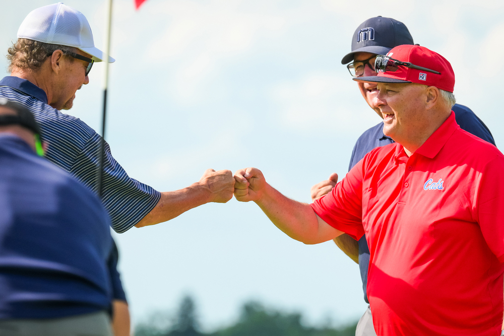 Two golfers celebrating