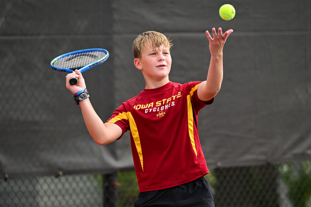 Boy playing tennis