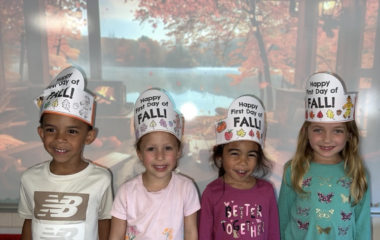students wearing “Happy Fall Y’all” hats