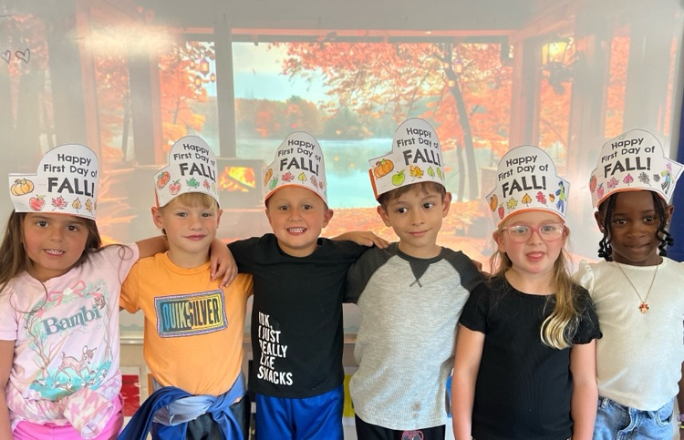 students wearing “Happy Fall Y’all” hats