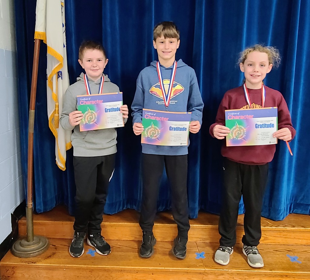 Students holding certificates