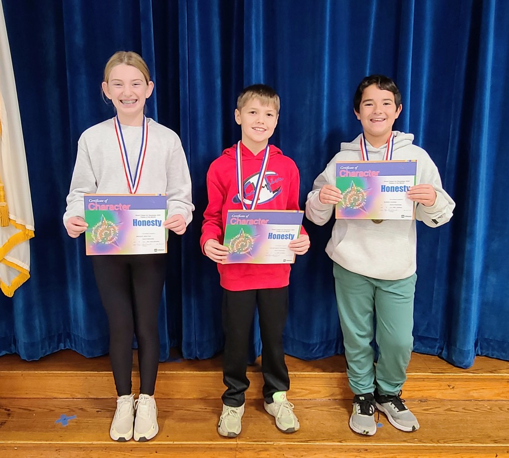 Students holding certificates