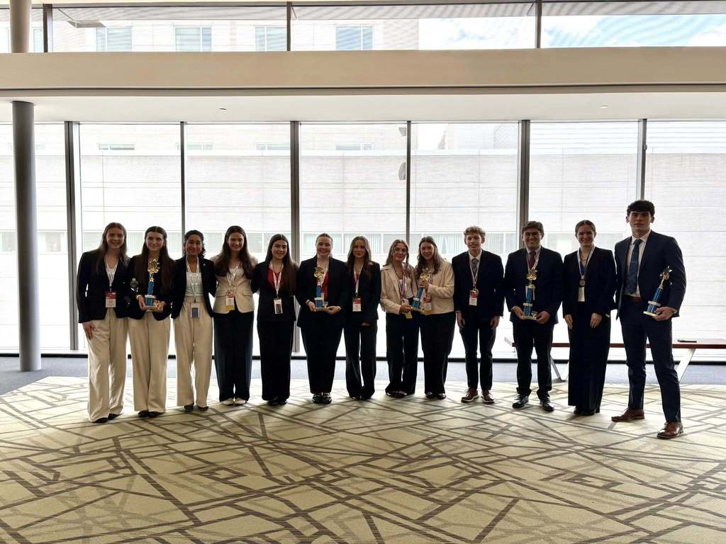 Group  of students with trophys.