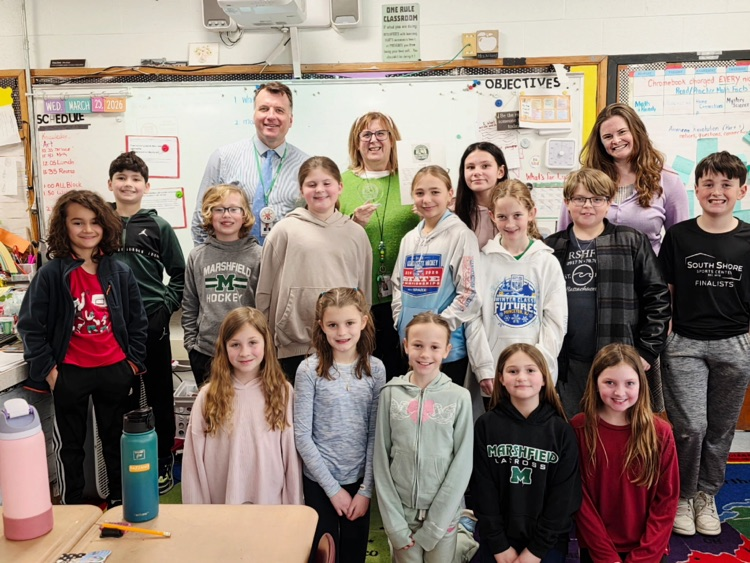 Mrs. Niland pictured with her class