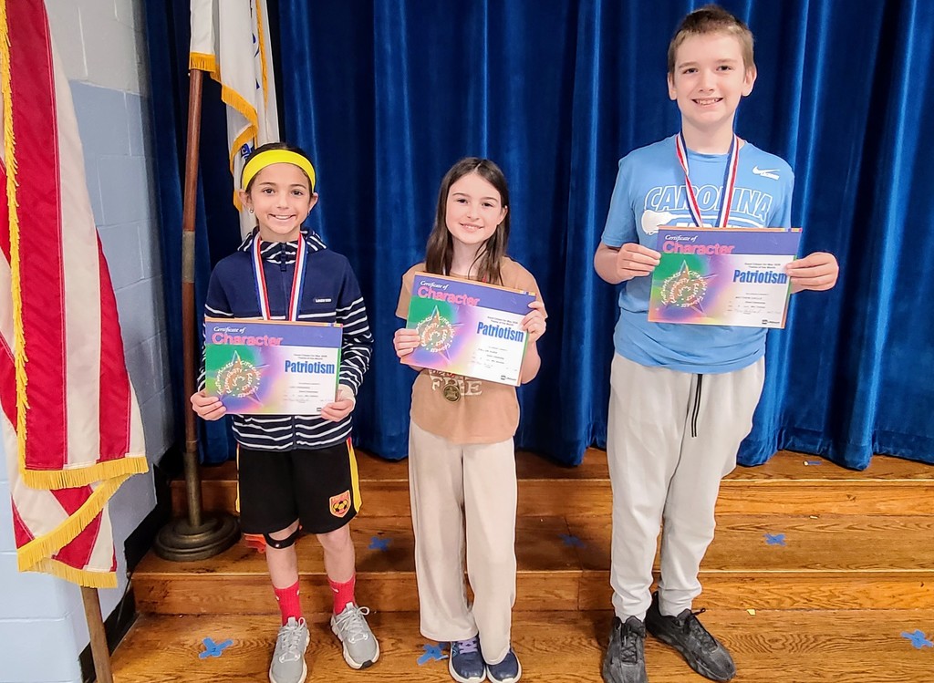Students holding certificates