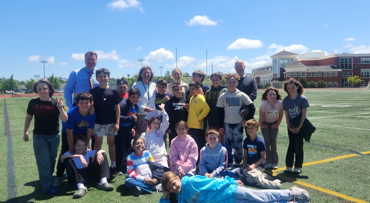 carly pictured outside with classmates