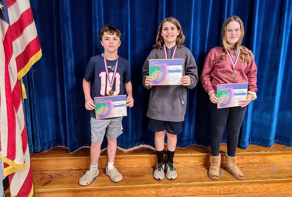 Students holding certificates