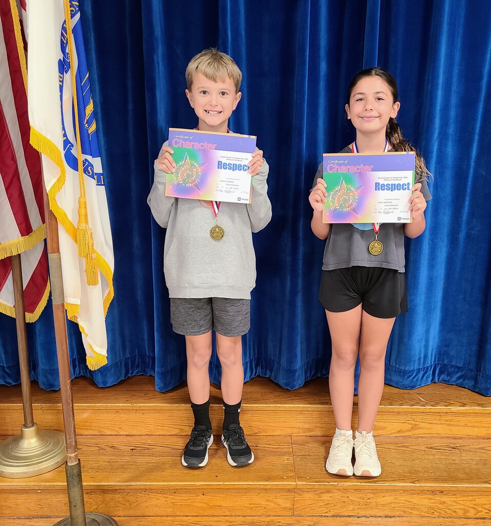 Students holding award certificates