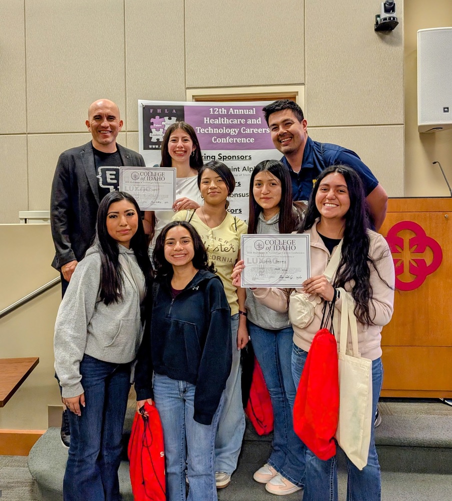 Mr. Garcia and students at an FHLA Conference