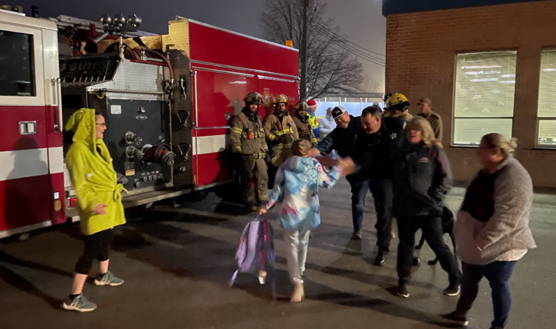 Staff and Fire Fighters greeting students