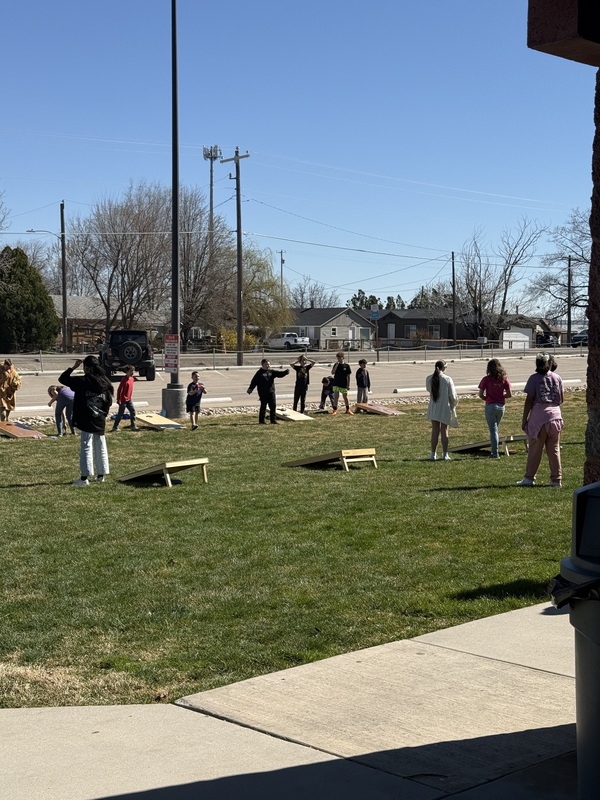 Kids playing Corn Hole