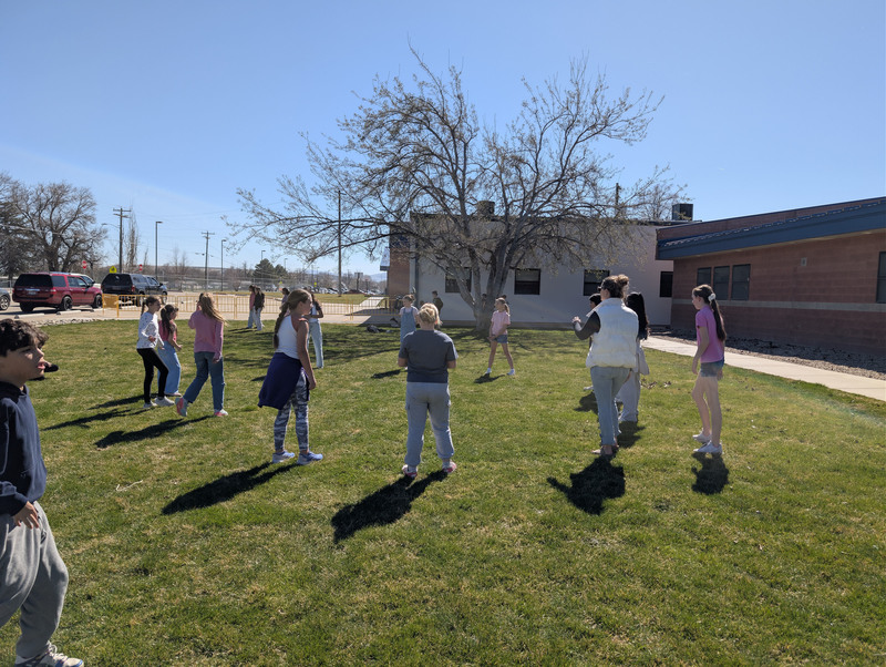 Teacher playing Volleyball with students
