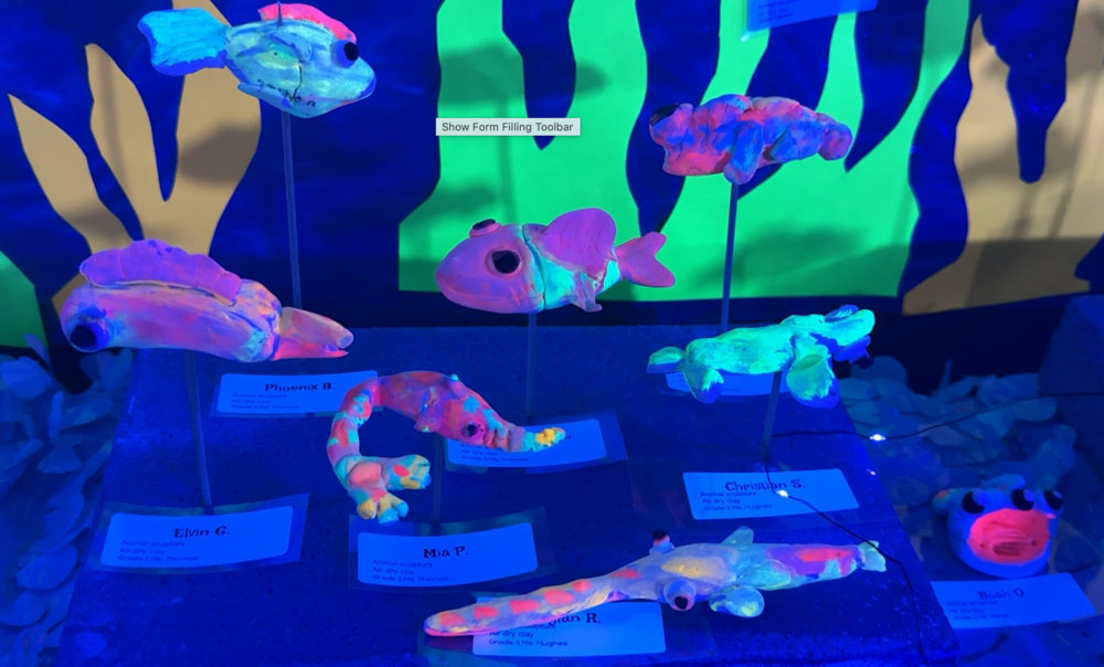 Glow-in-the-dark art work SeaWind students created on the ecosystem of the Everglades