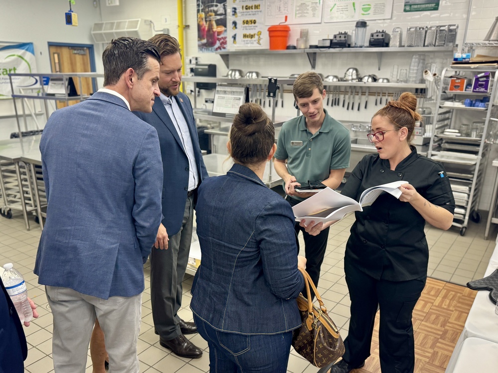 FLDOE State Board Members overlook MCHS Culinary competition meals and menu items