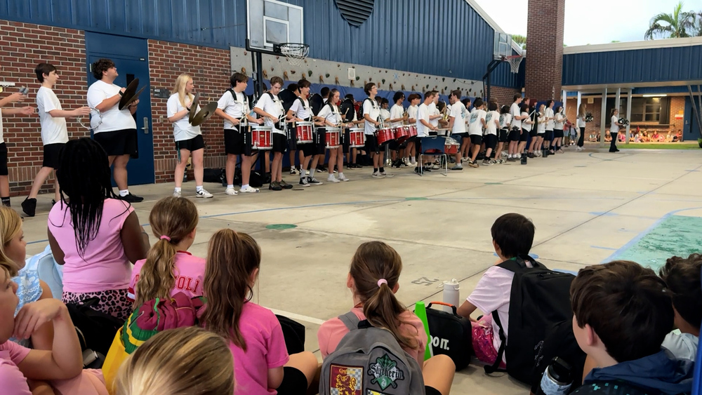 FAWE students watch Jensen Beach High School Band during the final morning of Start With Hello Week