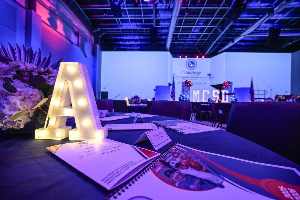 A letter on table at State of the District Breakfast